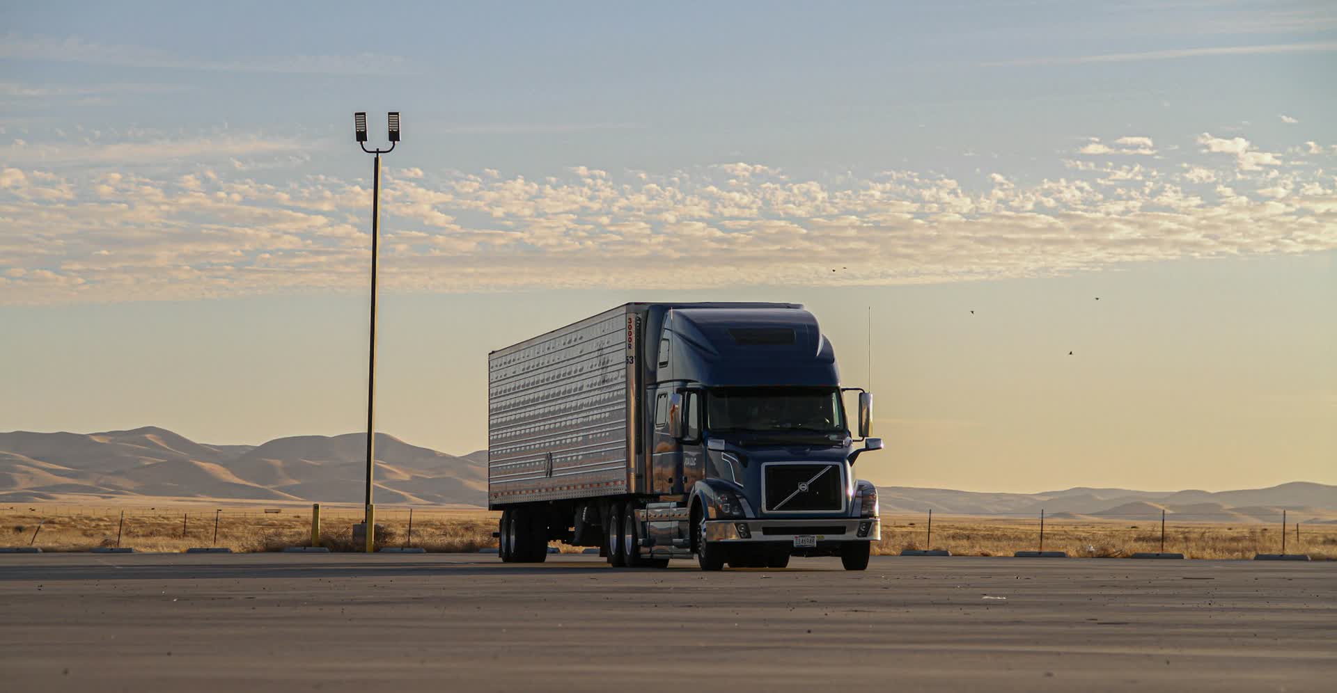 Truck parked at sunset